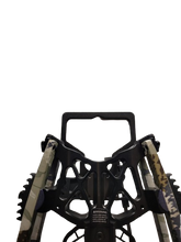 Load image into Gallery viewer, Black archery bow stand with camouflage arrows on a white background
